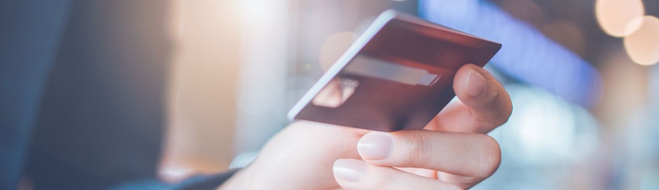 Debit card held in hand