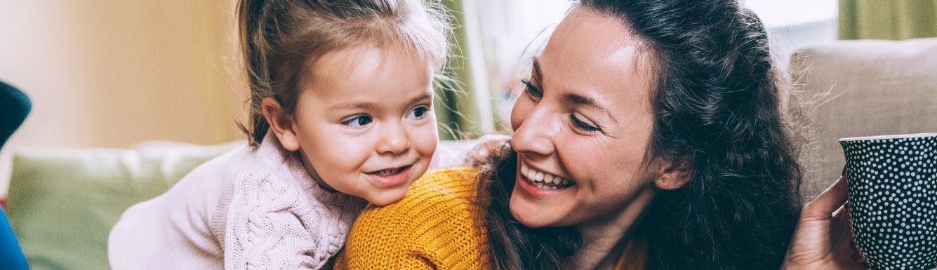 Daughter with mother in living room